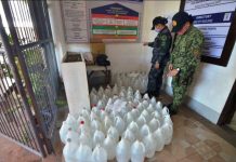 6 persons suspected of overpricing alcohol SEIZED ALCOHOL. Police officers check these plastic containers of alcohol seized from a group in an entrapment operation in Iloilo City. The group is suspected of selling alcohol at an overprice at a time when the city is battling to stop the spread of the coronavirus disease 2019. IAN PAUL CORDERO/PN