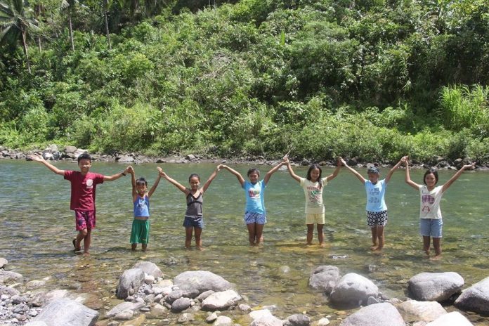 DENR-6 observes IDF 2020 amid COVID-19 threat Youths from Madalag, Aklan poses after their small group discussion about International Day of Forest in one of the protected area of DENR, the Aklan River Watershed Forest Reserve./PENRO Aklan