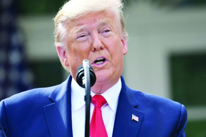 Donald Trump US President Donald Trump holds a press conference on COVID-19 in the Rose Garden of the White House on March 13, 2020. AFP