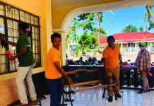Employees of the local government unit of Caluya, Antique disinfect their municipal hall as one of the preventive measures against the coronavirus disease 2019. MUNICIPALITY OF CALUYA
