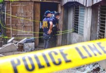 Ex-village watchman shot dead in Tigbauan house Policemen secure the house of a former barangay tanod in Barangay 9, Tigbauan, Iloilo.The ex-tanod was shot to death inside the house on Monday night, March 2, 2020. IAN PAUL CORDERO/PN