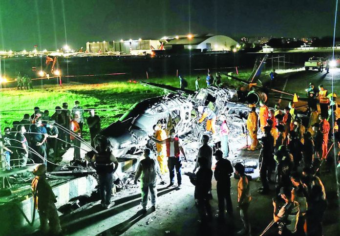 Investigators gather around burnt Lion Air plane at Ninoy Aquino International Airport Investigators gather around burnt Lion Air plane at Ninoy Aquino International Airport in Manila late night on Sunday. Eight persons, including two foreign nationals, were perished in the crash. EPA