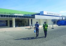 Carriers to cut Kalibo ops as COVID-19 threat persists These workers roam around the vicinity of the Kalibo International Airport. JUN AGUIRRE/PN