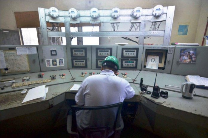 A personnel of MORE Electric and Power Corp. mans the switchboard of the power substation in Barangay Bolilao, Mandurriao, Iloilo City. The new power distributor has taken control of all power substations in Iloilo City. IAN PAUL CORDERO/PN
