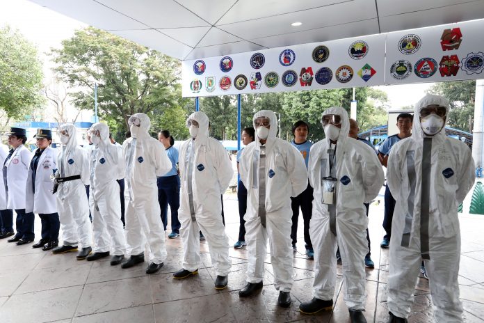PNP PPE FIGHT VS. CORONAVIRUS. Chemical, biological, radiological, nuclear and explosives (CBRNE)-trained personnel of the Philippine National Police (PNP) from its health service unit are ready to assist other government agencies in the repatriation of Filipinos in China and other countries affected by the 2019 novel coronavirus. Some of the personnel who are ready for deployment don face masks and protective clothing during an event after the flag-raising ceremony at the PNP Headquarters in Camp Crame on Feb. 3, 2020. PNA