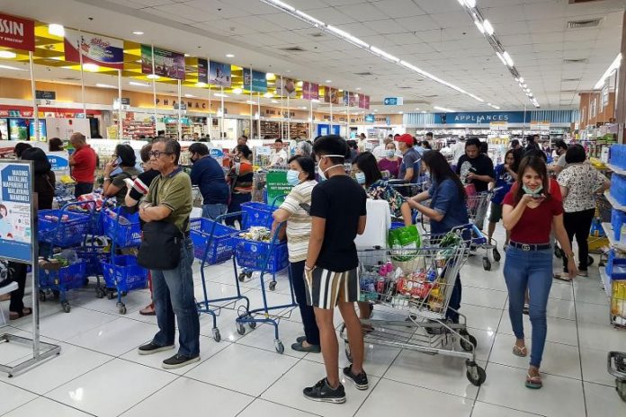 Panic Buying Coronavirus Shoppers endured long queues at checkout counters in groceries and supermarkets in Manila yesterday as word that a lockdown would be enforced set off panic buying across Metro Manila. Shelves were emptied quickly, with sanitisers, disinfectants, rice and cooking oil among the most sought-after items. EPA-EFE