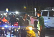 Panay-wide quarantine starts April1; Prov’l gov’ts to harmonize border restriction rules A personnel of the Pavia Emergency Responders check the body temperature of motorists using a thermal scanner at a checkpoint in Barangay Ungka, Pavia, Iloilo last night. Iloilo province is under a “general community quarantine” against the novel coronavirus. IAN PAUL CORDERO/PN