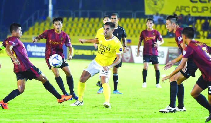 Players of the Stallion Laguna F.C. surround a Ceres-Negros booter during a Philippines Football League match in Bacolod City. BUSINESSWORLD