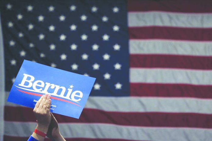 Sen. Bernie Sanders A supporter of Democratic presidential candidate Sen. Bernie Sanders, I-Vt., applauds as Sanders speaks during a campaign rally Monday, March 9, 2020. AP