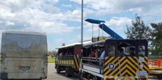 Silay City government provides trucks and a bus to the 84 Negrense persons under monitoring who arrived in Bacolod-Silay Airport in Negros Occidental from Clark International Airport going to a resort on Thursday. They will stay there for a 14-day mandatory quarantine for individuals with possible coronavirus disease 2019 infection. RYAN GAMBOA FACEBOOK PAGE