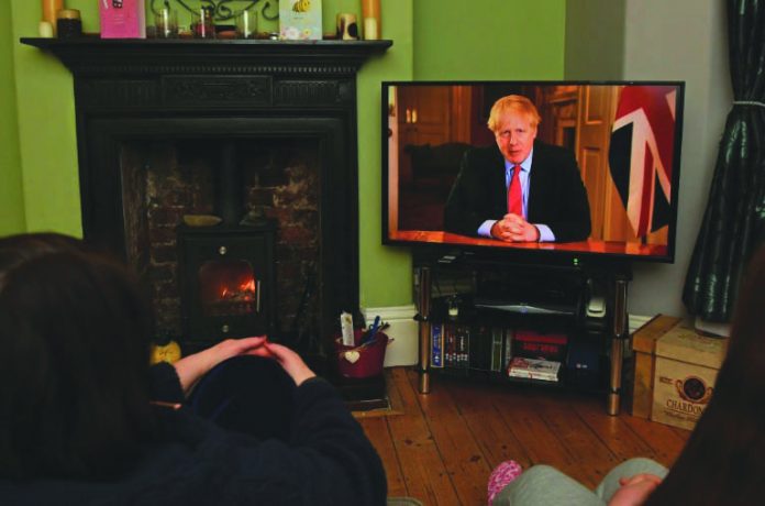 "Stay at home," Prime Minister Boris Johnson says in a televised address to the nation, as he unveiled unprecedented peacetime measures. AFP