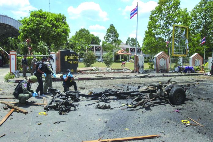 Thai crime scene investigators inspect the site of a bomb explosion in Yala, southern Thailand Thai crime scene investigators inspect the site of a bomb explosion in Yala, southern Thailand, Tuesday, March 17, 2020. AP