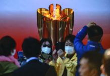 Thousands flock to see Olympic flame in Japan despite virus fears Organisers are under pressure to postpone the Tokyo 2020 Games because of the coronavirus pandemic. AFP