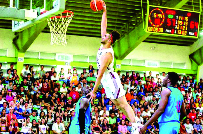 University of the Philippines Fighting Maroons’ Kobe Paras goes for a dunk during the team’s exhibition match with Iloilo Private Schools Athletic Association selection team last year. DON LACZI