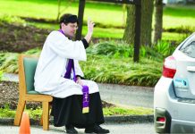 US priest offers drive-thru confessions Father Scott Holmer holds drive-through confessionals in Maryland, with his church closed due to the coronavirus. AFP