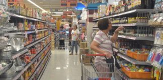 Proclamation 922 which puts the country under a state of public health emergency due to the novel coronavirus outbreak has triggered the implementation of a nationwide price freeze. Photo shows a woman checking prices at a grocery store in Iloilo City. IAN PAUL CORDERO/PN