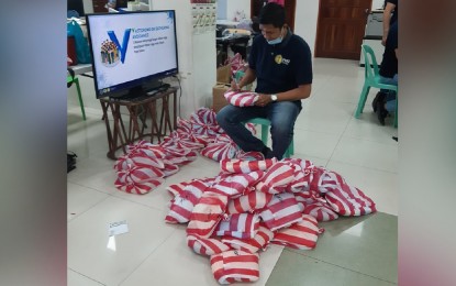 This man prepares personal protective equipment to be distributed to health practitioners in Antique on March 19. This man prepares personal protective equipment to be distributed to health practitioners in Antique on March 19. PNA