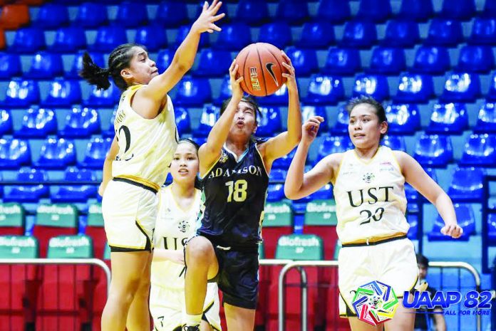 Players of the Baby Lady Falcons and the Junior Growling Tigresses in action before their championship series was suspended by the University Athletic Association of the Philippines.