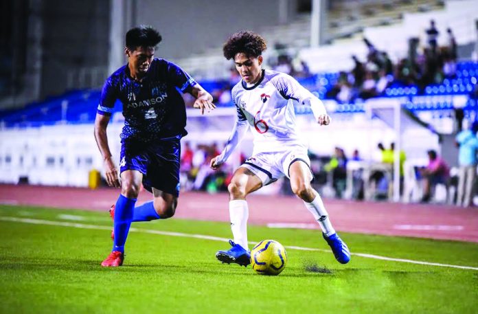 UE survives Adamson in UAAP football University of the East Red Warriors’ Nikko Palacio tries to trick an Adamson University Falcons defender. UAAP
