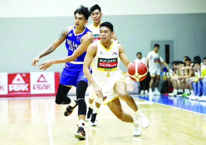 PBA D-League Negrense Mark Nonoy of Builders Warehouse-UST Tigers blows past his Diliman College Blue Dragons defender. PBA