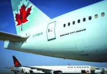 Air Canada to temporarily lay off half its workforce Air Canada has suspended most of its international flights due to the coronavirus. AFP