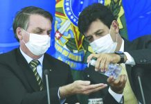 Brazil’s Bolsonaro fires health minister amid pandemic Brazil's Health Minister Luiz Henrique Mandetta, right, gives anti-bacterial gel to President Jair Bolsonaro as they give a press conference on the new coronavirus at Planalto presidential palace in Brasilia, Brazil. AFP