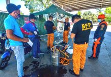 PREVENTIVE MEASURE. Personnel of the Bureau of Fire Protection are setting up a disinfection booth at the transport terminal in Barangay Ungka, Jaro, Iloilo City as an added measure against the spread of the coronavirus disease 2019. IAN PAUL CORDERO/PN