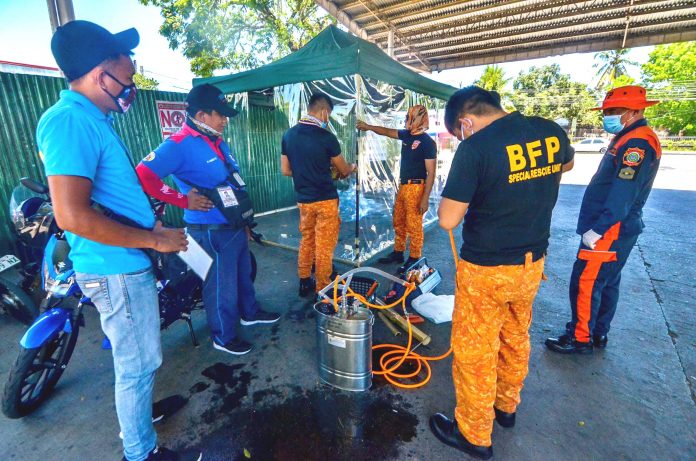 Bureau of Fire Protection Foot Bath PREVENTIVE MEASURE. Personnel of the Bureau of Fire Protection are setting up a disinfection booth at the transport terminal in Barangay Ungka, Jaro, Iloilo City as an added measure against the spread of the coronavirus disease 2019. IAN PAUL CORDERO/PN