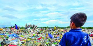 This young boy gazes at the sea of trash in Calajunan Sanitary Landfill, Mandurriao, Iloilo City. This dumpsite became his playground, where he forages for anything of value. Everyday, garbage trucks deliver tons of waste here. IAN PAUL CORDERO/PN