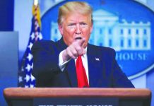 Trump to suspend all immigration into US United States President Donald Trump points to a reporter as he answers questions during the daily coronavirus task force briefing at the White House in Washington, U.S. on April 20, 2020. REUTERS