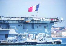 COVID-19 spreads on French aircraft carrier, hundreds infected French navy soldiers wearing facemasks stand onboard the French aircraft carrier Charles de Gaulle, as it arrives in the southern French port of Toulon, France with sailors onboard infected with novel coronavirus. AP FILE PHOTO