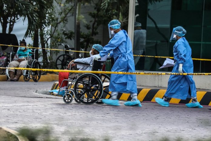 Frontline health personnel from the NKTI TRIAGE attend to patients coming into the hospital for treatment. ABS-CBN