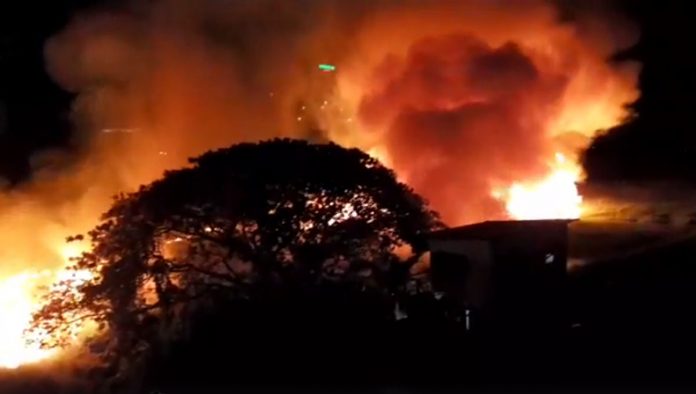 Grass Fire Plumes of smoke and flames are seen billowing from a vacant lot in Barangay Q. Abeto, Mandurriao, Iloilo City early morning on Easter Sunday. No one was injured in the fire, according to initial assessment from the Bureau of Fire Protection. CONTRIBUTED PHOTO