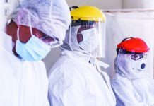Hospital frontliners wear protective gears as they man the entrance of the emergency room in the Gat Andres Bonifacio Memorial Medical Center in Tondo, Manila. Over 1,000 healthcare workers in the country were positive for coronavirus disease 2019, according to the Department of Health. ABS-CBN NEWS