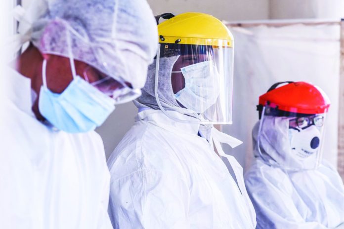 Hospital frontliners wear protective gears Hospital frontliners wear protective gears as they man the entrance of the emergency room in the Gat Andres Bonifacio Memorial Medical Center in Tondo, Manila. Over 1,000 healthcare workers in the country were positive for coronavirus disease 2019, according to the Department of Health. ABS-CBN NEWS