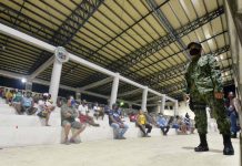 WV quarantine curfew violators rise to over 4K CURFEW VIOLATORS. A policeman guards these persons “detained” at the Iloilo City Freedom Grandstand for defying the enhanced community quarantine curfew from 8 p.m. to 5 a.m. A total of 142 violators were arrested before dawn yesterday. Since the police detention cell is too small for these violators to observe social distancing, the police brought them to the grandstand. IAN PAUL CORDERO/PN