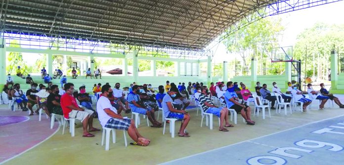 Informal workers in the municipality of Tubungan, Iloilo Informal workers in the municipality of Tubungan, Iloilo province, whose sources of income were affected by the coronavirus disease 2019 (COVID-19), attend Department of Labor and Employment’s TUPAD program. The program’s beneficiaries will earn P395 per day in their 10 days work of disinfecting their respective houses to curb the spread of COVID-19. EMZ ESTANDO