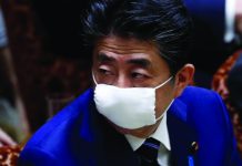 Japan PM to declare state of emergency Japan's Prime Minister Shinzo Abe wears a protective face mask as he attends an upper house parliamentary session, following an outbreak of the coronavirus disease (COVID-19), in Tokyo, Japan April 1, 2020. REUTERS