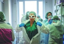 WHO: ‘Long way to go’ in coronavirus crisis Medical workers get ready for a shift treating coronavirus patients at the Spasokukotsky clinical hospital in Moscow, Russia. AFP
