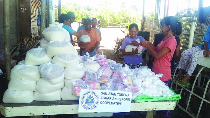 Members of the San Juan Torena Agrarian Reform Cooperative in Barangay Caduha-an, Cadiz City, Negros Occidental distribute relief packs Members of the San Juan Torena Agrarian Reform Cooperative in Barangay Caduha-an, Cadiz City, Negros Occidental distribute relief packs to its members and other agrarian reform beneficiaries from neighboring villages affected by the coronavirus disease 2019 outbreak. The organization aims to be a great part of the community while people are coping back in life amid the present crisis. PIA