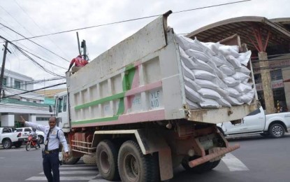 National Food Authority-Negros Occidental A truck leaves the National Food Authority-Negros Occidental warehouse in Bacolod City on Mar. 27, 2020 carrying government rice for distribution to families affected by the 14-day enhanced community quarantine to curb the spread of coronavirus pandemic in the province. The NFA said Tuesday it has fully released about P63 million worth of rice to all towns and cities in Negros Occidental. PHOTO COURTESY OF PIO NEGROS OCCIDENTAL