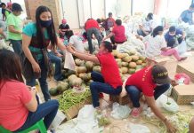 Sara folks get vegetables as relief items amid quarantine Personnel of the local government unit of Sara, Iloilo and volunteers prepare food packs to be distributed to the town’s residents on April 1. Beneficiaries will receive vegetables aside from the usual food packs. SARA GUGMA KO