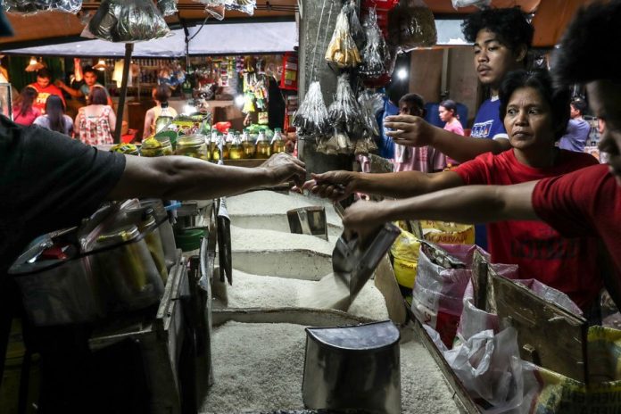 Rice People buy rice at a residential street market in Manila, Feb. 7, 2018. ABS-CBN