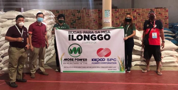 Rice for Ilonggos The Iloilo City government represented by Executive Assistant Francis Cruz (second from left) accepts from MORE Electric and Power Corp. president Roel Z. Castro (extreme left) a donation of 30 sacks of rice. MORE Power previously donated facemasks, alcohol, sanitizers, and food packs to frontliners in Iloilo City battling the spread of the coronavirus disease 2019.