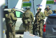 16 killed in Canada shooting rampage Members of a Royal Canadian Mounted Police tactical unit confer after a suspect in a deadly shooting rampage was neutralized at the Big Stop near Elmsdale, Nova Scotiam, Canada. AFP