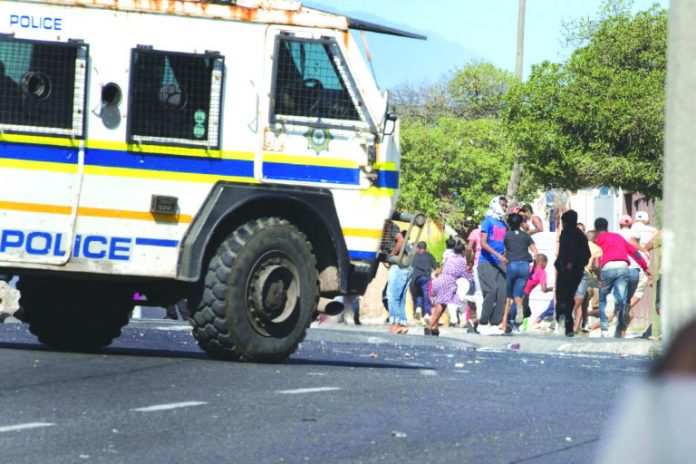 South African police clashed with Cape Town township residents South African police clashed with Cape Town township residents protesting over access to food aid during a coronavirus lockdown. AFP