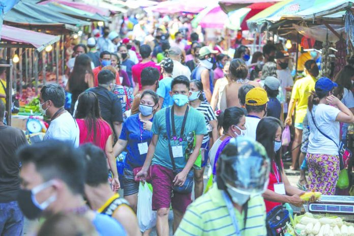 Throngs of people gather around market stalls on Blumentritt Street in Manila Throngs of people gather around market stalls on Blumentritt Street in Manila on April 21, 2020 even as police were asked to enforce physical distancing measures under the enhanced community quarantine. ABS-CBN NEWS