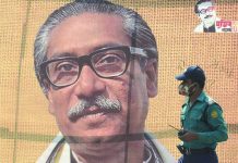 Bangladesh executes killer of founding leader In this file photo taken on March 09, 2020 a policeman wearing a facemask amid fears of the spread of COVID-19 novel coronavirus, walks past a banner with a picture of Bangladesh’s founder Sheikh Mujibur Rahman in Dhaka. AFP