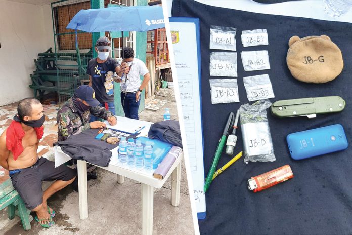 An antidrug officer inspects items seized from resident James Brisuela in Barangay 3, Bacolod City on May 4.