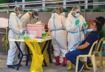 WVMC LAB VOWS FASTER TESTING Fully covered with personal protective equipment, these healthcare personnel of the Iloilo City government are tasked to extract specimens from clients for analysis at the Western Visayas Medical Center laboratory. The city government is ramping up mass testing for coronavirus disease. IAN PAUL CORDERO/PN